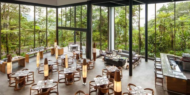 The restaurant at Mashpi lodge offers gourmet meals with fresh, authentic ingredients. The restaurant at Mashpi Lodge in Ecuador.
