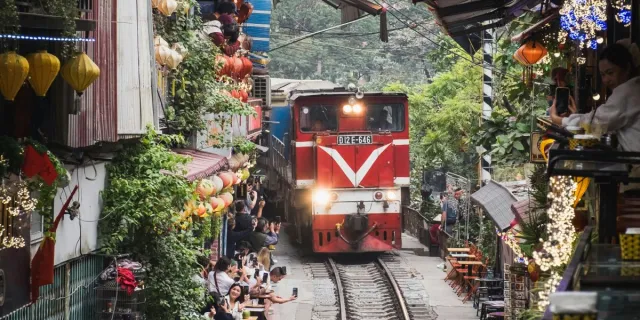 A train in a 'train street' in Hanoi, Vietnam.[copyright]Image by Teodor Kuduschiev/Unsplash[/copyright]