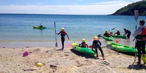Setting off to explore sea caves from Swanpool Beach, Falmouth.